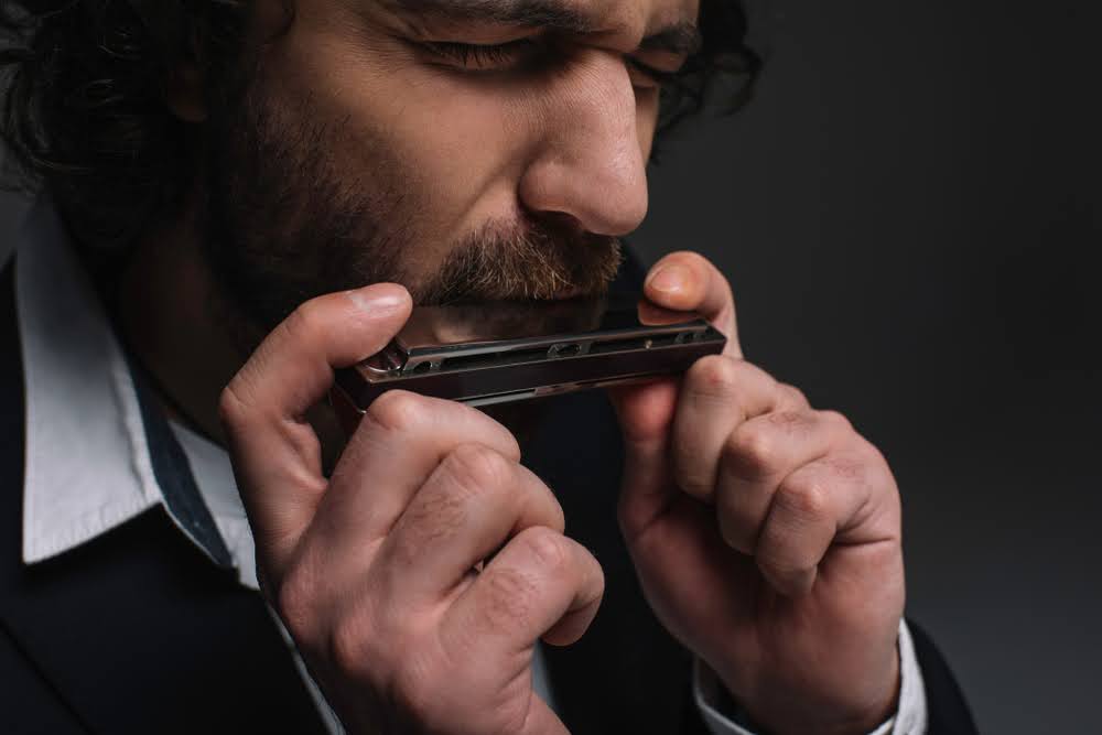 A man playing harmonica