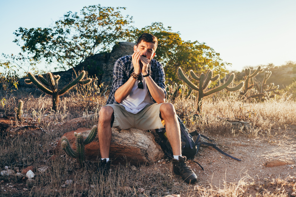 A man practicing advanced harmonica techniques.