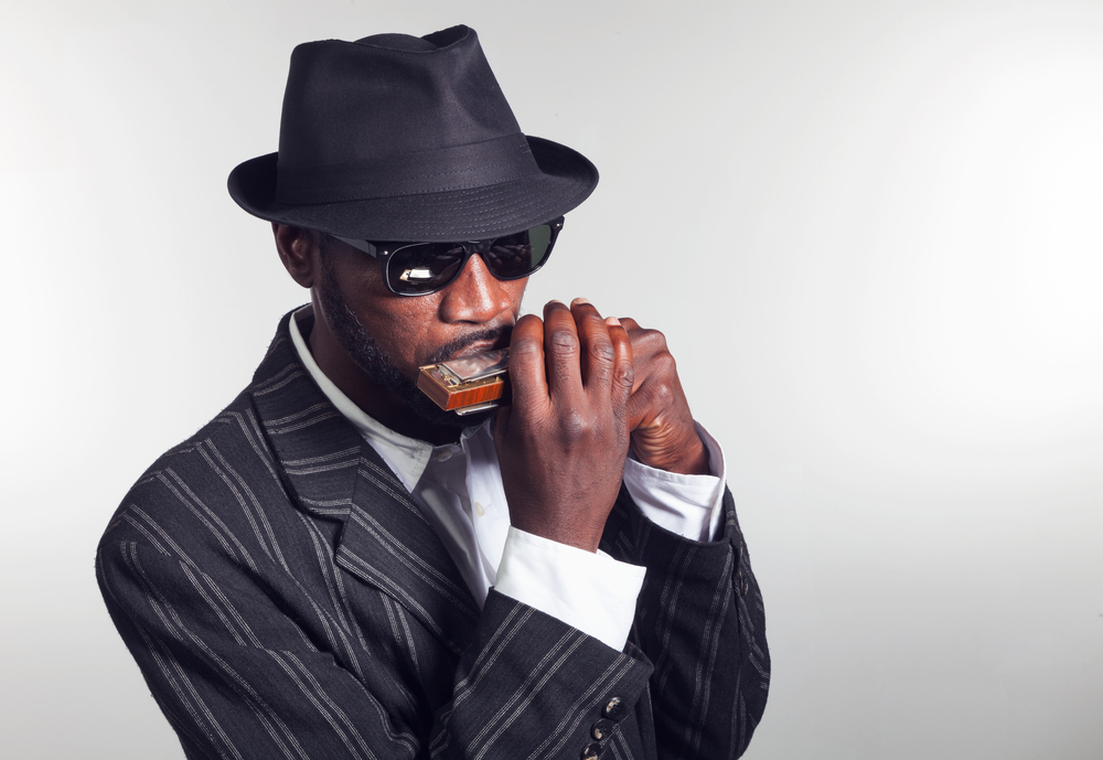 A man playing the harmonica.